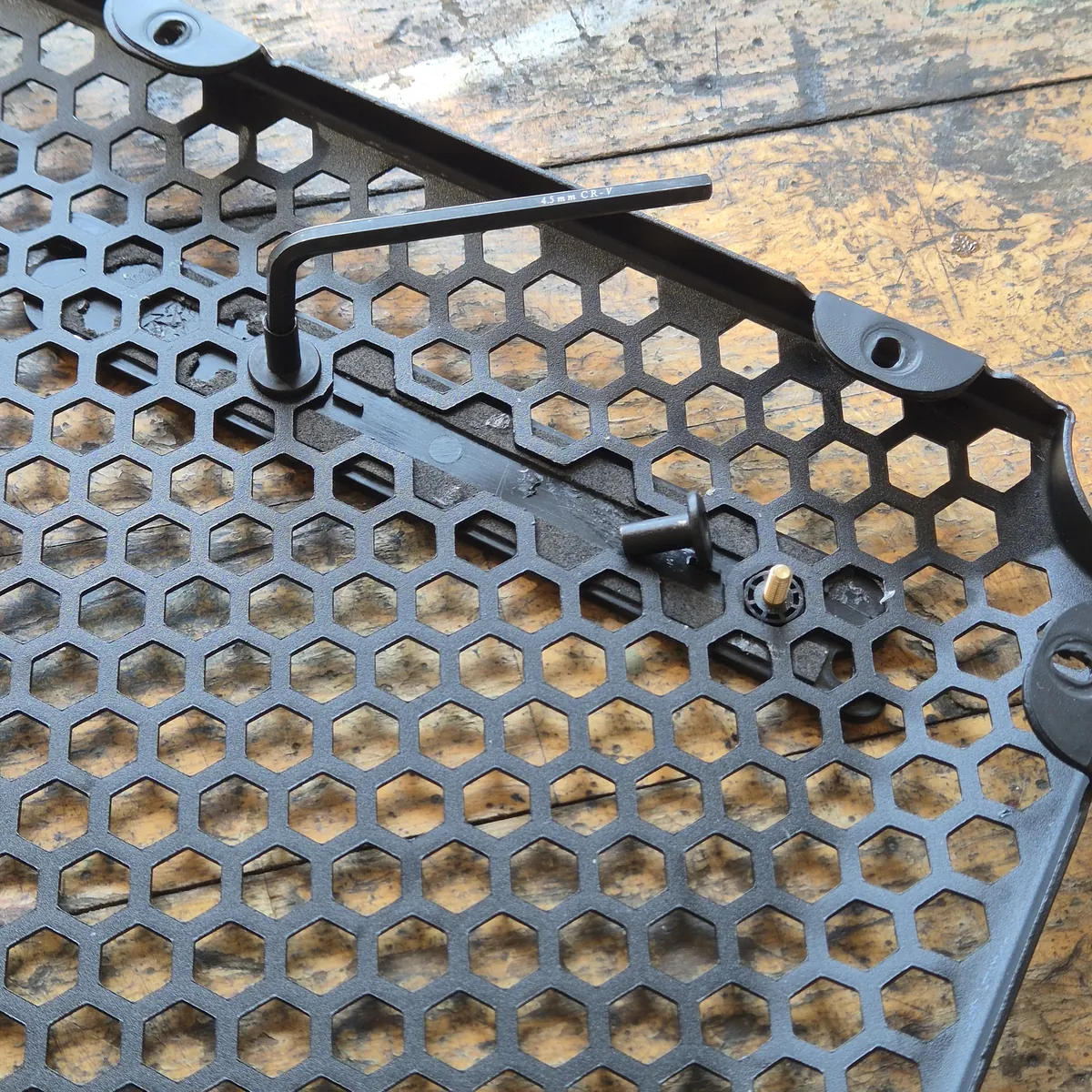 Step 3 — unscrew the nuts from the logo
