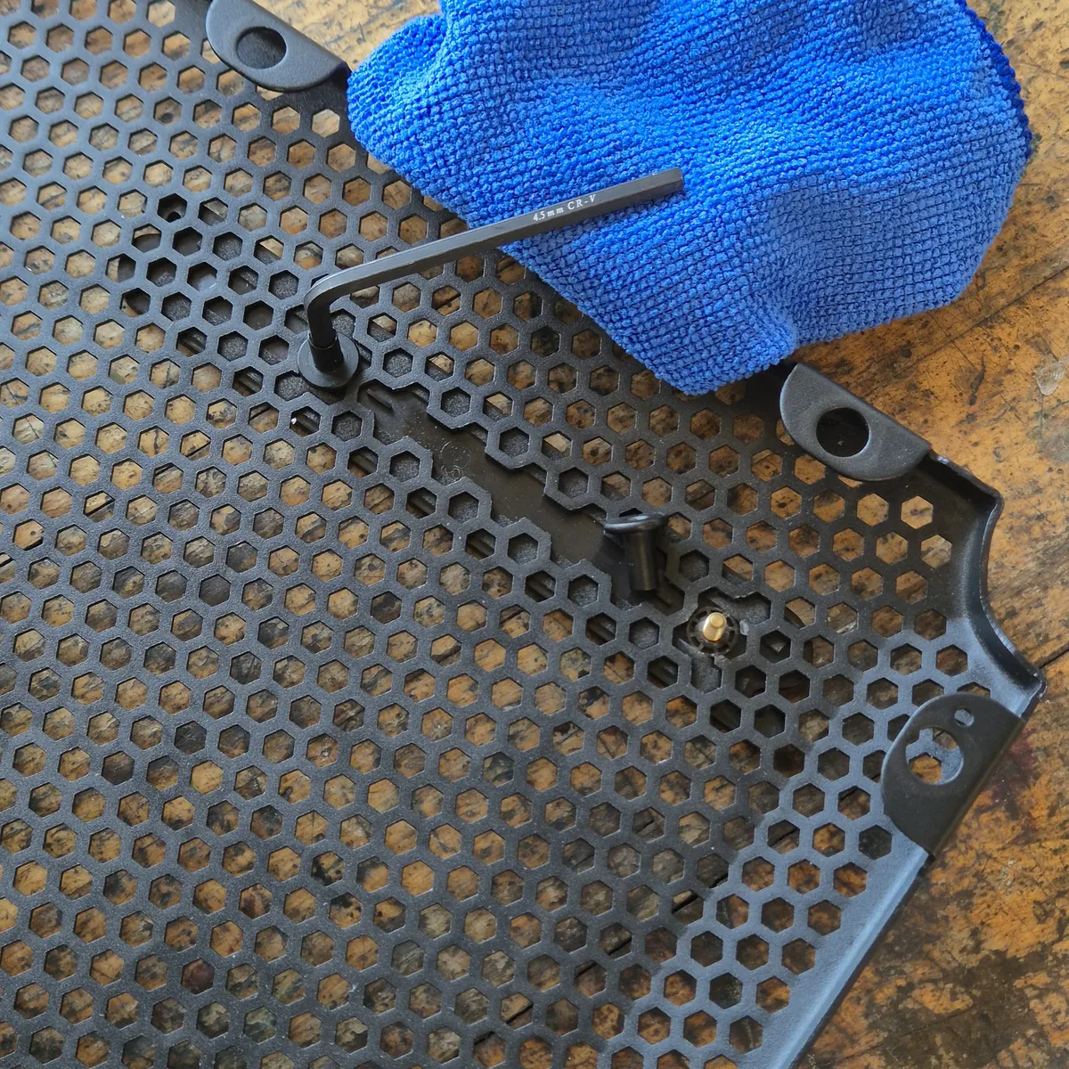 Step 4 — unscrew the nuts from the logo