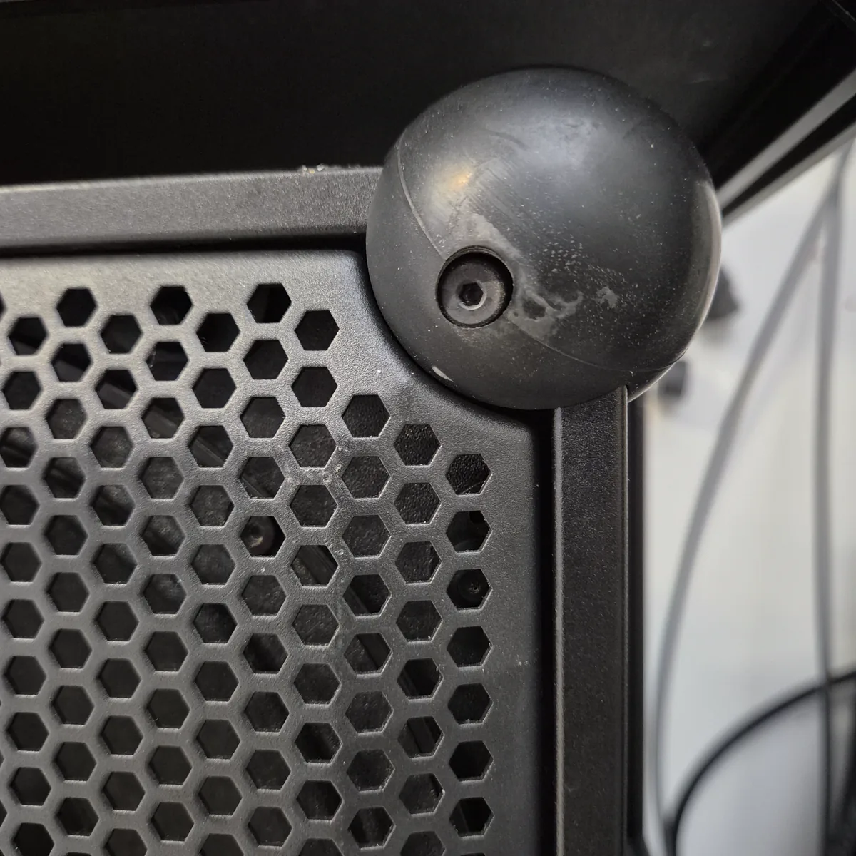 Close-up of the front grill on a Soundboks 4 with small, dense hexagons